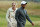 GULLANE, SCOTLAND - JULY 15:  Tiger Woods of the United States smiles alongside skier Lindsey Vonn ahead of the 142nd Open Championship at Muirfield on July 15, 2013 in Gullane, Scotland.  (Photo by Andy Lyons/Getty Images)