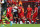 LIVERPOOL, ENGLAND - AUGUST 17:  Simon Mignolet of Liverpool is congratulated by his captain Steven Gerrard after saving a penalty from Jonathan Walters of Stoke City during the Barclays Premier League match between Liverpool and Stoke City at Anfield on August 17, 2013 in Liverpool, England.  (Photo by Clive Brunskill/Getty Images)