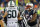 A referee pushes Jets OL D'Brickashaw Ferguson away from Patriots LB Dont'a Hightower