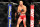 Sep 4, 2013; Belo Horizonte, BRAZIL;  Yushin Okami (red shorts) enters his fight against Ronaldo Jacare Souza (not pictured) during UFC Fight Night at Mineirinho Arena. Mandatory Credit: Jason Silva-USA TODAY Sports