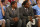 Nov 8, 2013; Chapel Hill, NC, USA; North Carolina Tar Heels guard Leslie McDonald (2) and guard P.J. Hairston (15) on the bench in suits during the first half at Dean E. Smith Student Activities Center. Mandatory Credit: Bob Donnan-USA TODAY Sports