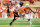 AUSTIN, TX - NOVEMBER 16:  Quandre Diggs #6 of the Texas Longhorns pursues Charlie Moore #17 of the Oklahoma State Cowboys during a game at Darrell K Royal-Texas Memorial Stadium on November 16, 2013 in Austin, Texas.  (Photo by Stacy Revere/Getty Images)