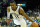 MEMPHIS, TN - NOVEMBER 04:  Mike Conley #11 of the Memphis Grizzlies dribbles the ball during the NBA game against the Boston Celtics at FedExForum on November 4, 2013 in Memphis, Tennessee.  NOTE TO USER: User expressly acknowledges and agrees that, by downloading and or using this Photograph, user is consenting to the terms and condition of the Getty Images License Agreement.  (Photo by Andy Lyons/Getty Images)