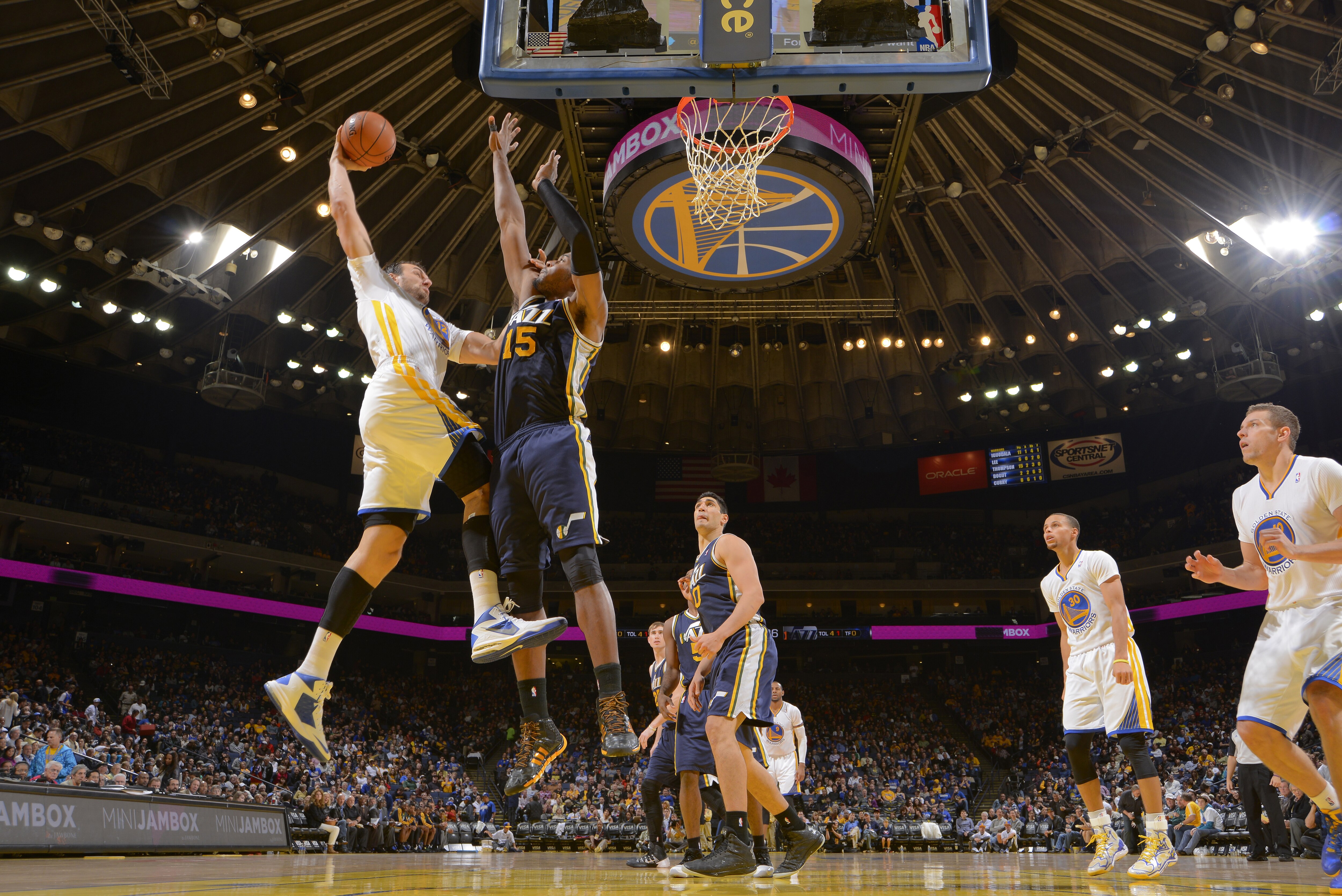 Though denied on this play, big Andrew Bogut gave the Warriors 12 points against the Jazz November 16—including 10 second-half points.