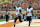 Nov 16, 2013; Austin, TX, USA; Oklahoma State Cowboys quarterback Clint Chelf (10) and fulback Desmond Roland (9) celebrate after a touchdown against the Texas Longhorns during the first quarter at Darrell K Royal-Texas Memorial Stadium. Mandatory Credit: Brendan Maloney-USA TODAY Sports