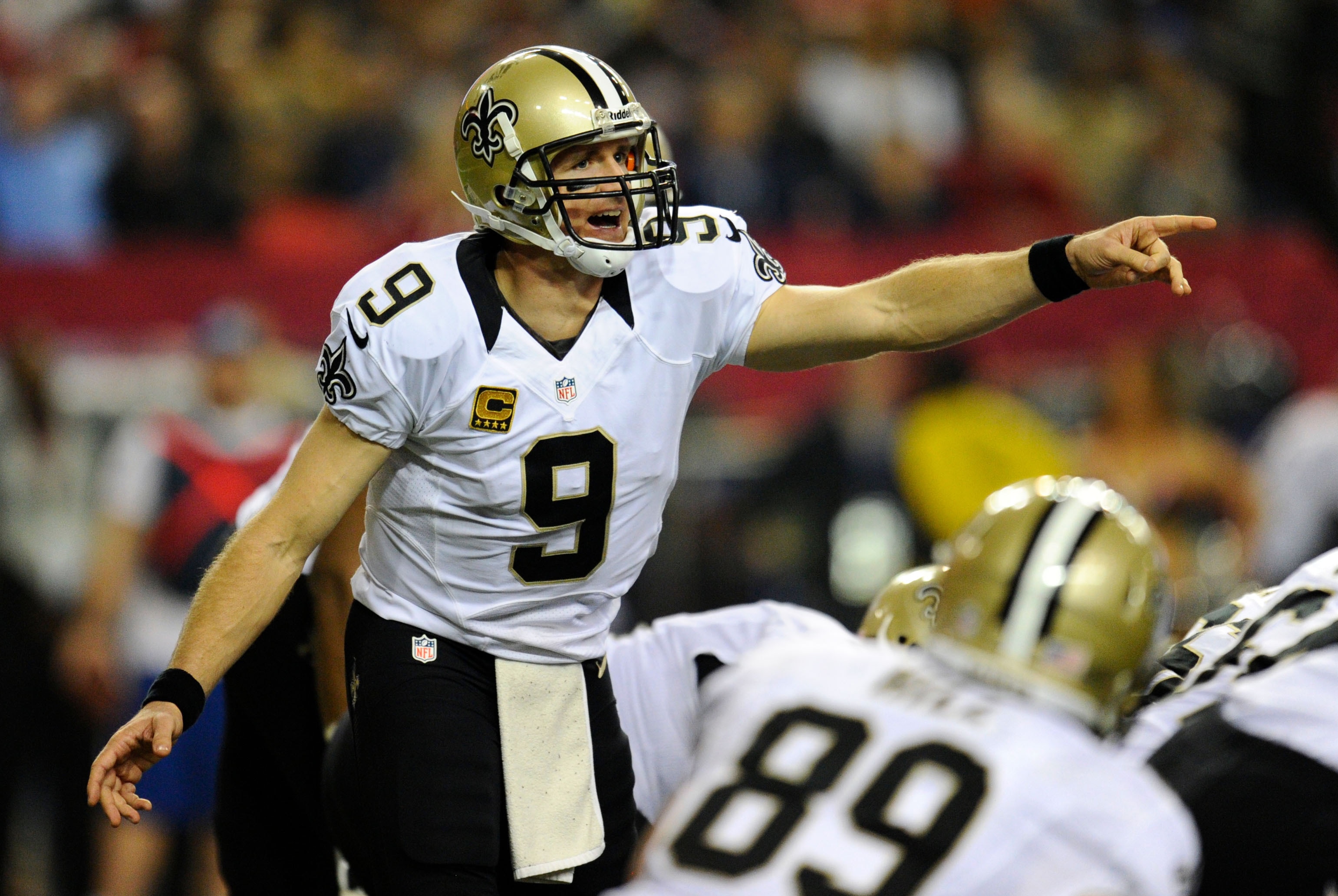 Nov 21, 2013; Atlanta, GA, USA; New Orleans Saints quarterback Drew Brees (9) calls a play against the Atlanta Falcons during the second half at the Georgia Dome. The Saints defeated the Falcons 17-13. Mandatory Credit: Dale Zanine-USA TODAY Sports