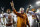 FORT WORTH, TX - OCTOBER 26:  Head coach Mack Brown of the Texas Longhorns celebrates with Desmond Jackson #99 of the Texas Longhorns and Josh Turner #5 of the Texas Longhorns after the Longhorns beat the TCU Horned Frogs 30-7 at Amon G. Carter Stadium on October 26, 2013 in Fort Worth, Texas.  (Photo by Tom Pennington/Getty Images)