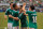 Jun 3, 2012; Arlington, TX, USA; Mexico forward Giovani dos Santos (10) and forward Javier Chicharito Hernandez (14) and midfielder Andres Guardado (18) celebrate a goal against Brazil during the first half at Cowboys Stadium. Mexico shut out Brazil 2-0. Mandatory Credit: Jerome Miron-USA TODAY Sports