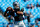 CHARLOTTE, NC - DECEMBER 01:  Cam Newton #1 of the Carolina Panthers warms up before a game against the Tampa Bay Buccaneers at Bank of America Stadium on December 1, 2013 in Charlotte, North Carolina.  (Photo by Grant Halverson/Getty Images)