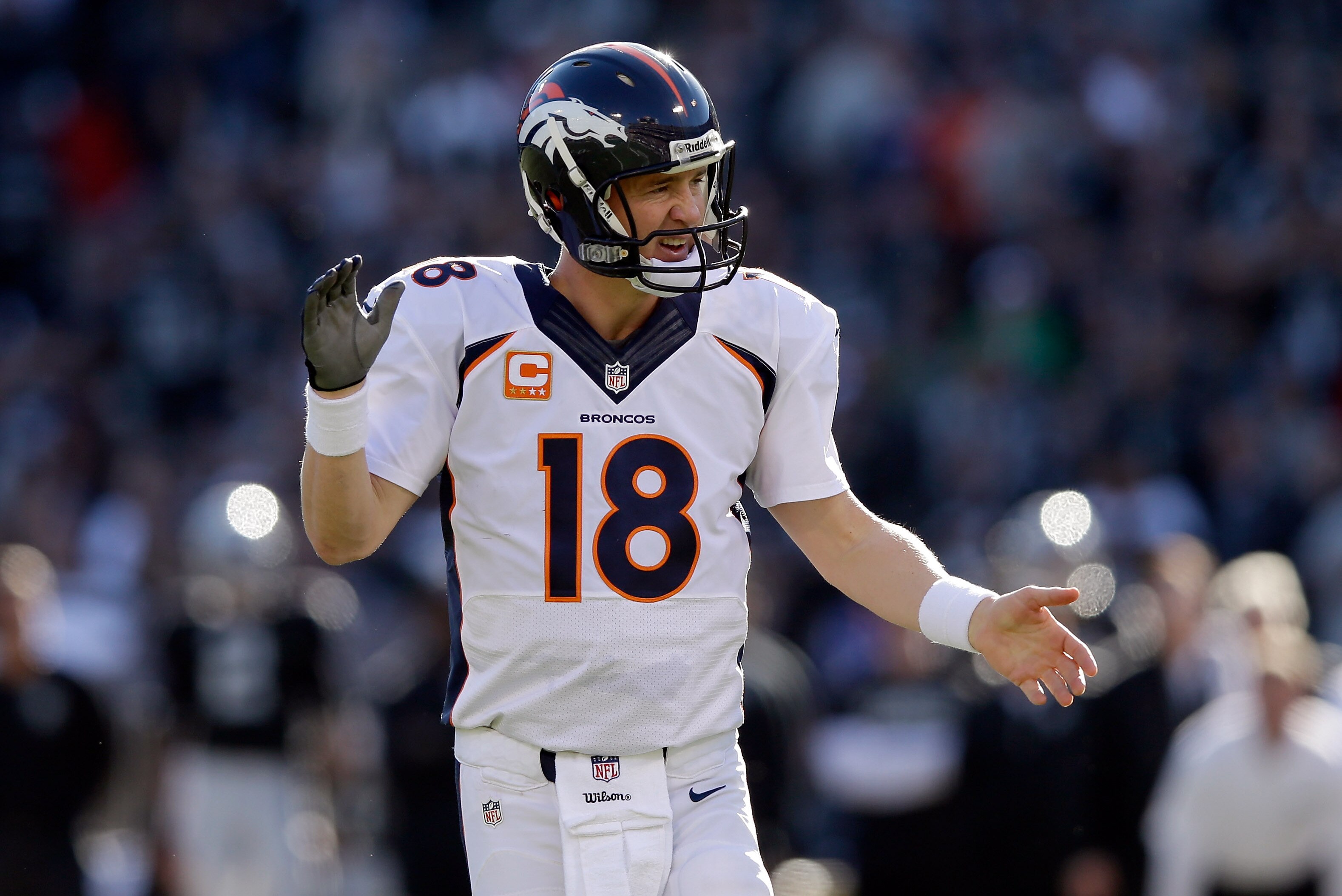 OAKLAND, CA - DECEMBER 29: Peyton Manning #18 of the Denver Broncos reacts after he threw his second touchdown pass during their game against the Oakland Raiders at O.co Coliseum on December 29, 2013 in Oakland, California. (Photo by Ezra Shaw/Getty Images)