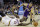 Cleveland Cavaliers' Anthony Bennett (15) bats a loose ball away from Los Angeles Lakers' Kendall Marshall in the fourth quarter of an NBA basketball game on Wednesday, Feb. 5, 2014, in Cleveland. The Lakers won 119-108. (AP Photo/Mark Duncan)