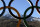 The Caucasus Mountains rise beyond a set of Olympic Rings Thursday, Feb. 6, 2014, in Rosa Khutor, Russia. The area will host the alpine events at the 2014 Winter Olympics which opens Friday, Feb. 7. (AP Photo/Charlie Riedel)