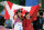 Canada's Alex Bilodeau, left, celebrates with his brother Frederic after winning the gold medal in the men's moguls final at the Rosa Khutor Extreme Park at the 2014 Winter Olympics, Monday, Feb. 10, 2014, in Krasnaya Polyana, Russia.  (AP Photo/Andy Wong)
