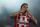 Javier Saviola  celebrates his first goal with Olympiakos, against Atromitos  during a Greek league soccer match at the Karaiskaki stadium in the port of Piraeus, near Athens, Sunday, Aug. 25, 2013. Javier Saviola scored the winner with a header in the 54th minute to give Olympiakos a 2-1 victory over visiting Atromitos in the Greek league. (AP Photo/Kostas Tsironis)