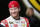 Dale Earnhardt, Jr., smiles as he stands talking with crew members in the garage during NASCAR Sprint Cup auto racing practice Saturday, March 1, 2014, in Avondale, Ariz. (AP Photo/Ross D. Franklin)
