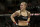 Ronda Rousey reacts after defeating Sara McMann following a UFC 170 mixed martial arts women's bantamweight title bout on Saturday, Feb. 22, 2014, in Las Vegas. (AP Photo/Isaac Brekken)