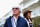 AUSTIN, TX - NOVEMBER 14:  F1 supremo Bernie Ecclestone and his wife Fabiana Flosi arrive in the paddock during previews to the United States Formula One Grand Prix at Circuit of The Americas on November 14, 2013 in Austin, United States.  (Photo by Paul Gilham/Getty Images)