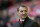 Liverpool's manager Brendan Rodgers smiles as he takes to the touchline before his team's English Premier League soccer match against Swansea City at Anfield Stadium, Liverpool, England, Sunday Feb. 23, 2014. (AP Photo/Jon Super)