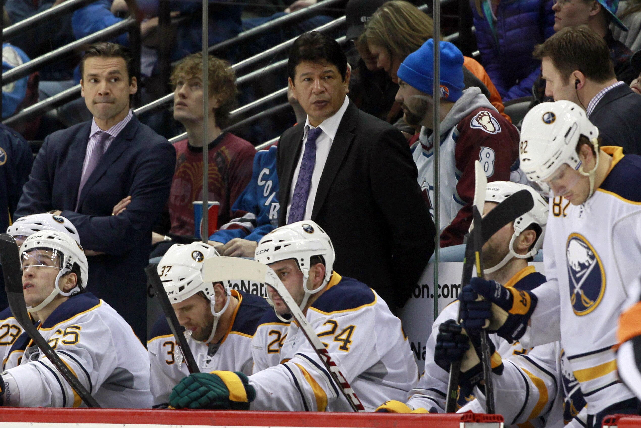 Buffalo Sabres interim head coach Ted Nolan, top center, looks on as his team falls behind the Colorado Avalanche in the third period of the Avalanche's 7-1 victory in an NHL hockey game in Denver, Saturday, Feb. 1, 2014. (AP Photo/David Zalubowski)