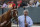 Thoroughbred trainer Steve Asmussen leads Tapiture  to the paddock before the $600,000 Rebel Stakes horse race at Oaklawn Park in Hot Springs, Ark., Saturday, March 15, 2014. (AP Photo/Danny Johnston)