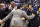 INDIANAPOLIS, IN - MARCH 30:  head coach John Calipari of the Kentucky Wildcats celebrates with his coaching staff after defeating the Michigan Wolverines 75 to 72 in the midwest regional final of the 2014 NCAA Men's Basketball Tournament at Lucas Oil Stadium on March 30, 2014 in Indianapolis, Indiana.  (Photo by Jonathan Daniel/Getty Images)