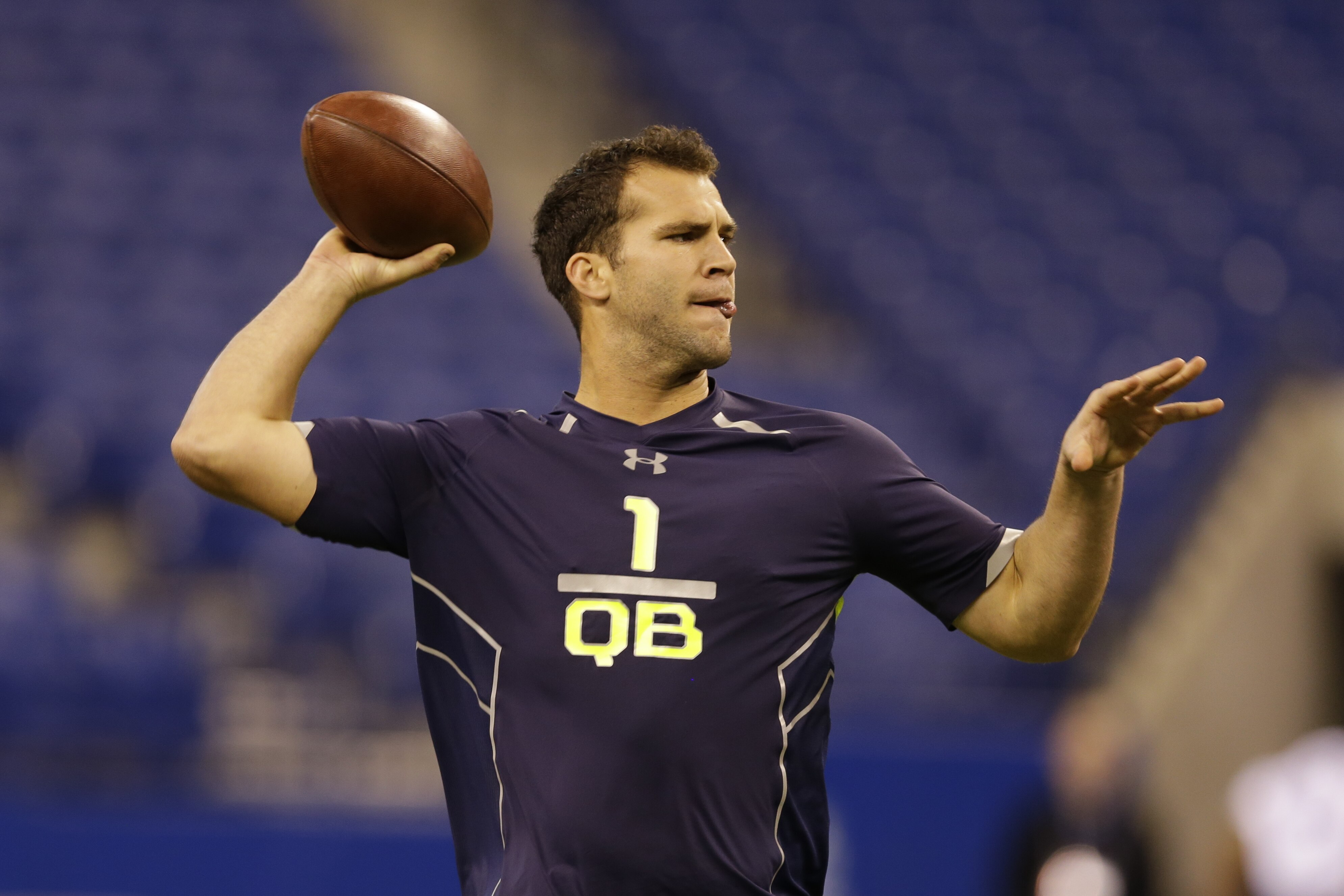 Central Florida quarterback Blake Bortles throws during a drill at the NFL football scouting combine in Indianapolis, Sunday, Feb. 23, 2014. (AP Photo/Michael Conroy)