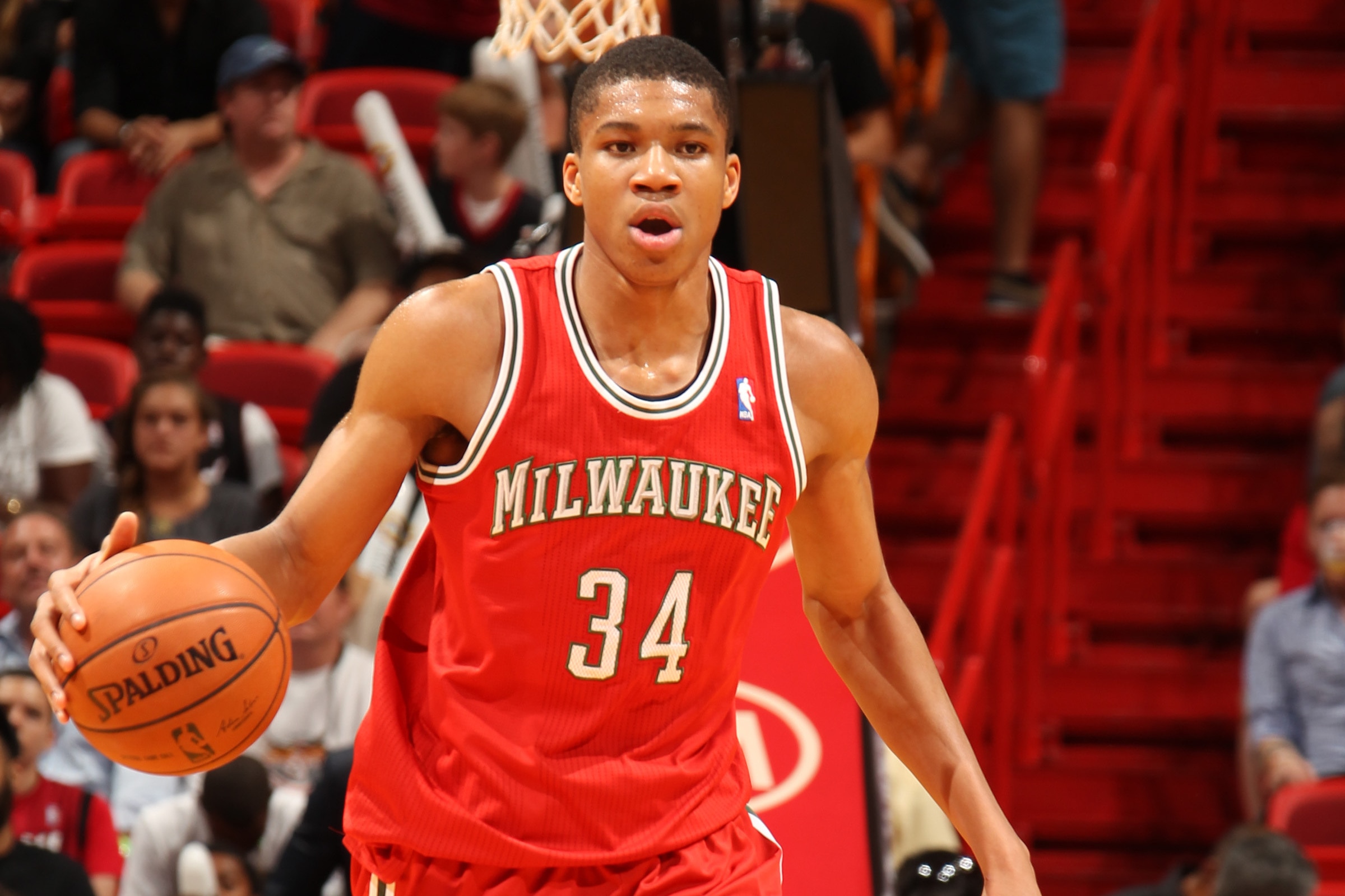 MIAMI, FL - April 2: Giannis Antetokounmpo #34 of the Milwaukee Bucks handles the ball against the Miami Heat at the American Airlines Arena in Miami, Florida on April, 2 2014. NOTE TO USER: User expressly acknowledges and agrees that, by downloading and/or using this photograph, user is consenting to the terms and conditions of the Getty Images License Agreement. Mandatory copyright notice: Copyright NBAE 2014 (Photo by Issac Baldizon/NBAE via Getty Images)