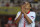 Sevilla's Carlos Bacca, celebrates after scoring a goal during a Europa League group H soccer match against Freiburg at the Ramon Sanchez Pizjuan stadium in Sevilla, Spain, Thursday, Oct. 3, 2013.  (AP Photo/Toni Rodriguez)