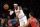 New York Knicks' Carmelo Anthony, left, passes the ball past Chicago Bulls' D.J. Augustin during the first half of the NBA basketball game, Sunday, April 13, 2014 in New York. The Knicks defeated the Bulls 100-89. (AP Photo/Seth Wenig)