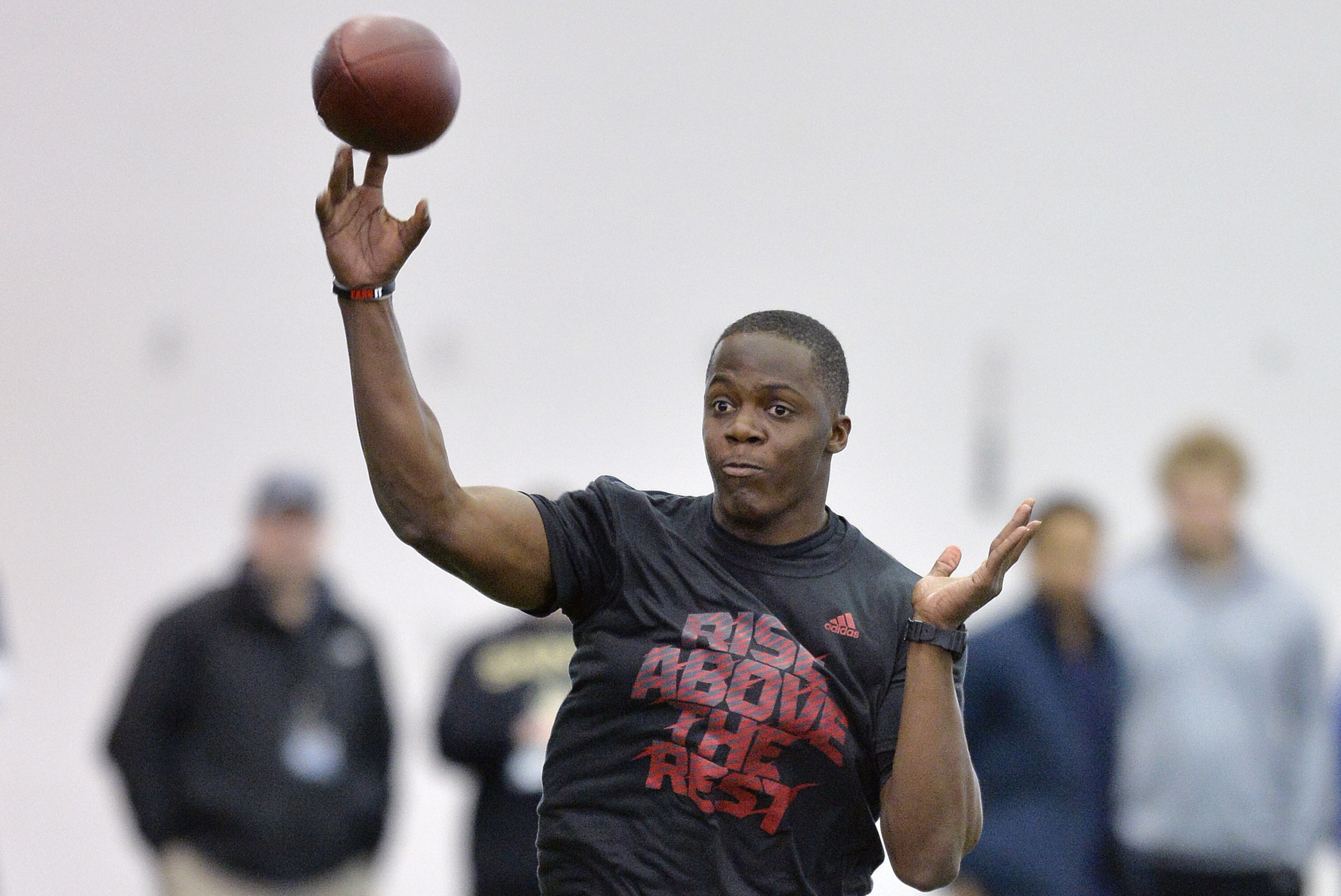 Louisville quarterback Teddy Bridgewater participates in a passing drill for NFL representatives during pro day at the University of Louisville in Louisville, Ky., Monday, March 17, 2014. (AP Photo/Timothy D. Easley)