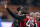 MILAN, ITALY - MARCH 29:  Mario Balotelli of AC Milan celebrates scoring the first goal during the Serie A match between AC Milan and AC Chievo Verona at San Siro Stadium on March 29, 2014 in Milan, Italy.  (Photo by Claudio Villa/Getty Images)