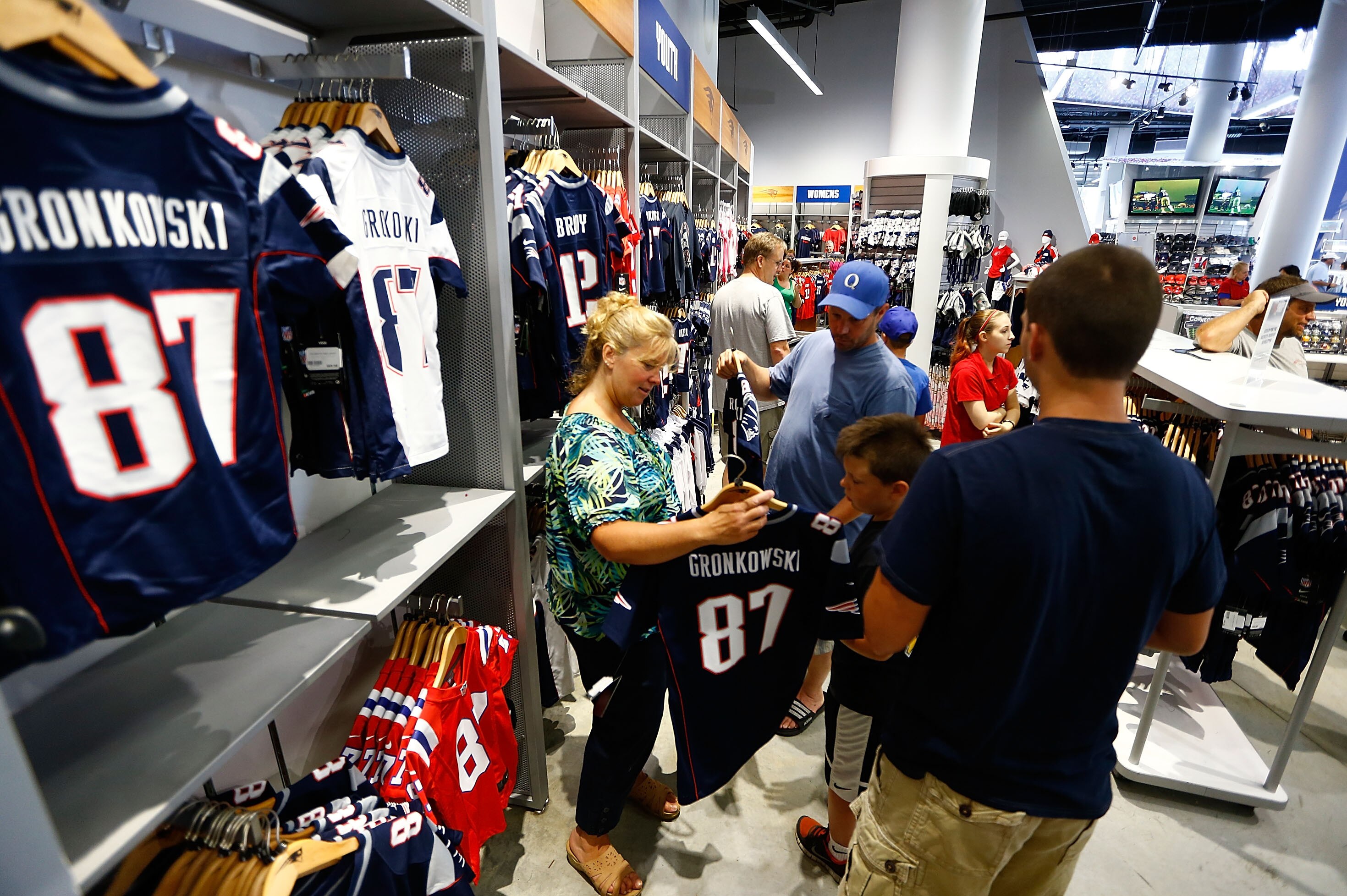 FOXBORO, MA - JULY 7: New England Patriots fans trade in their Aaron Hernandez jerseys during a free exchange at the pro shop at Gillette Stadium on July 7, 2013 in Foxboro, Massachusetts. (Photo by Jared Wickerham/Getty Images)