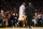 Los Angeles Lakers' Kobe Bryant walks to go into the game as he talks with head coach Mike D'Antoni  against the Toronto Raptors during the second half of an NBA basketball game in Los Angeles, Sunday, Dec. 8, 2013. It was Bryant's first game back after a torn left Achilles tendon injury on April 12th and the Raptors won 106-94. (AP Photo/Danny Moloshok)