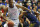 Kansas center Joel Embiid (21) pushes off West Virginia forward Devin Williams, right, during the first half of an NCAA college basketball game in Lawrence, Kan., Saturday, Feb. 8, 2014. Embiid scored 11 points in the game. Kansas defeated West Virginia 83-69. (AP Photo/Orlin Wagner)