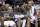 San Antonio Spurs' Tony Parker, left, of France, Tim Duncan, center, and Manu Ginobili, right, sit on the bench during the second half of Game 1 of a Western Conference semifinal NBA basketball playoff series against the Portland Trail Blazers, Tuesday, May 6, 2014, in San Antonio. San Antonio won 116-92. (AP Photo/Eric Gay)