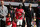 Arsenal's manager Arsene Wenger, center right, and Bacary Sagna, center left, wave to the supporters as the team parade around the stadium in their last home match of the season, after their English Premier League soccer match against West Bromwich Albion at Emirates Stadium in London, Sunday, May 4, 2014. (AP Photo/Sang Tan)