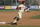 Florida State's Danny De La Calle (13) rounds third base as he heads home to score in the sixth inning of an NCAA college baseball game against Miami on Sunday, March 2, 2014, in Tallahassee, Fla. Florida State won 13-6. (AP Photo/Phil Sears)