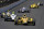 Ryan Hunter-Reay leads Ed Carpenter into the first turn during the 98th running of the Indianapolis 500 IndyCar auto race at the Indianapolis Motor Speedway in Indianapolis, Sunday, May 25, 2014. (AP Photo/Darron Cummings)