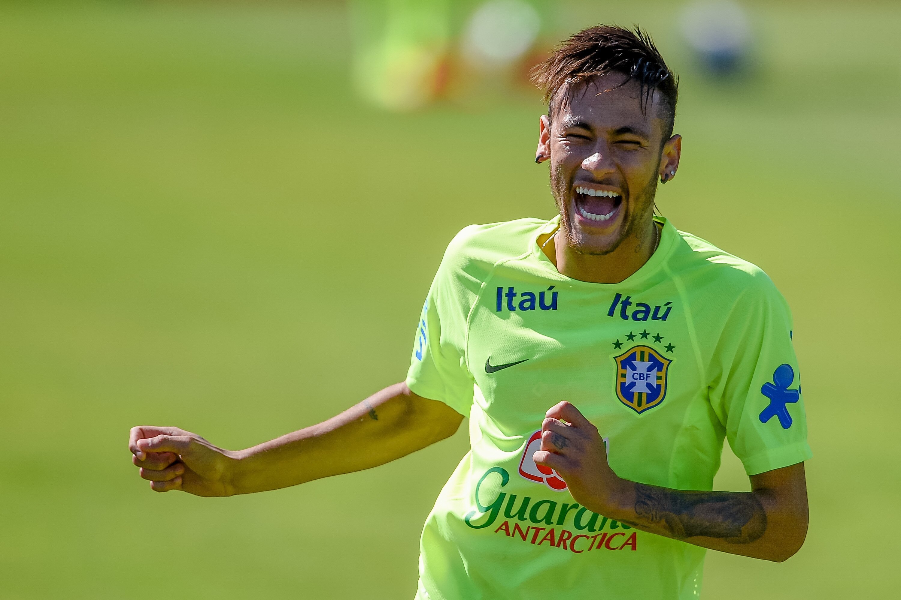 TERESOPOLIS, BRAZIL - MAY 30: Neymar smiles during a training session of the Brazilian national football team at the squad's Granja Comary training complex, in Teresopolis, 90 km from downtown Rio de Janeiro on May 30, 2014 in Teresopolis, Brazil. (Photo by Buda Mendes/Getty Images)