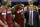 Miami Heat forward LeBron James (6) is helped from the court by guard Mario Chalmers (15), guard Dwyane Wade (3), Erik Spoelstra, front, right, and Rashard Lewis, right rear, during the second half in Game 1 of the NBA basketball finals on Thursday, June 5, 2014 in San Antonio. (AP Photo/Eric Gay)