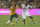 Australia's Luke Wilkshire, left, tries to hold back South Africa's Themba Zane during their friendly soccer match in Sydney, Australia, Monday, May 26, 2014. (AP Photo/Rob Griffith)