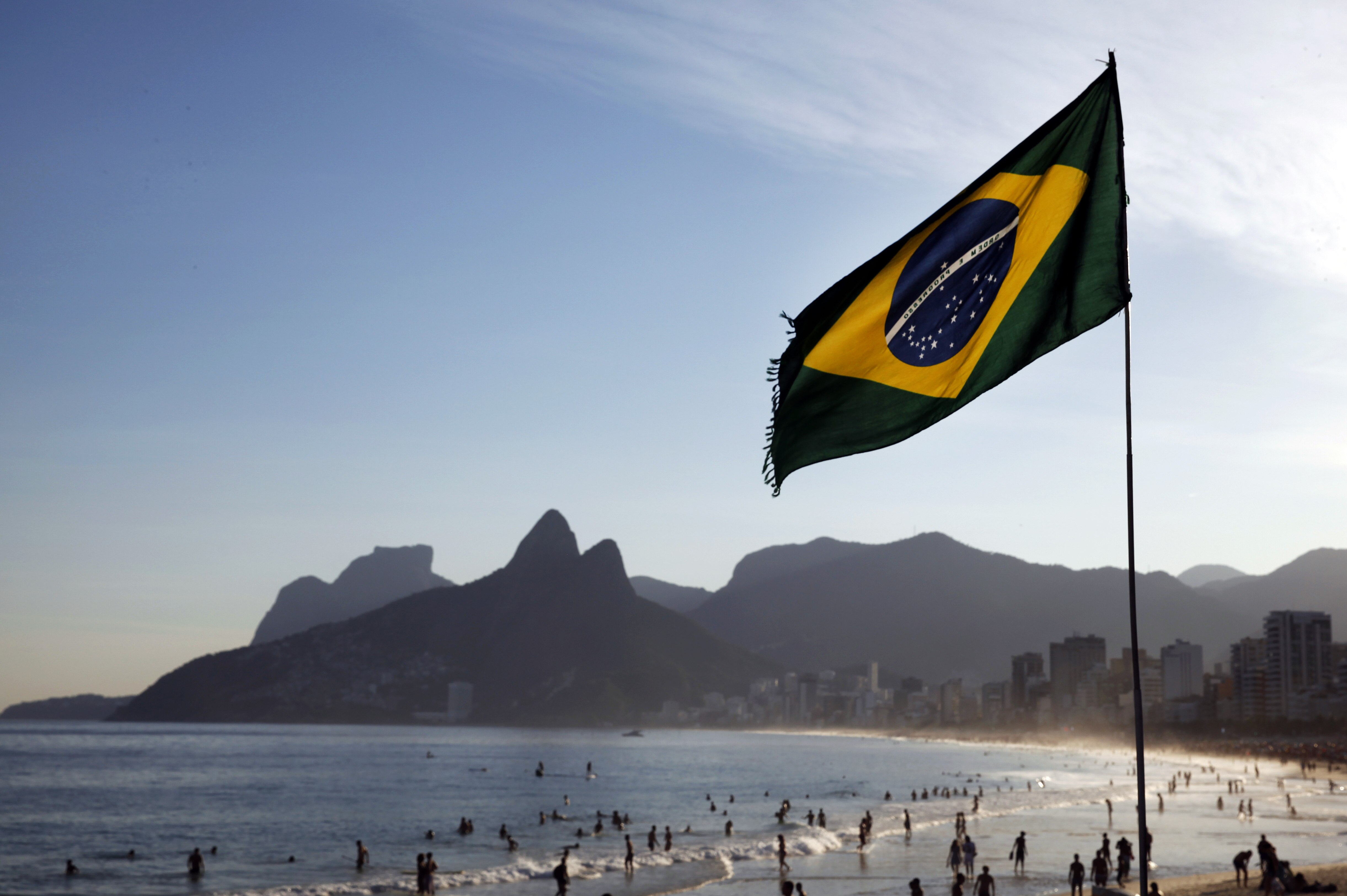 RIO DE JANEIRO, BRAZIL - JUNE 08: A Brazilian flag waves on Ipanema Beach as the 2014 FIFA World Cup nears on June 8, 2014 in Rio de Janeiro, Brazil. (Photo by Jamie Squire/Getty Images)