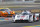 The Audi R18 E-tron driven by Filipe Albuquerque, Marco Bonanomi of Italy, and Oliver Jarvis of Great Britain, in a curve of the Mans circuit, during a free practice session for the 24-hour Le Mans endurance race, in Le Mans, western France, Wednesday, June 11, 2014. The race will take place on Saturday and Sunday. (AP Photo/Remy de la Mauviniere)