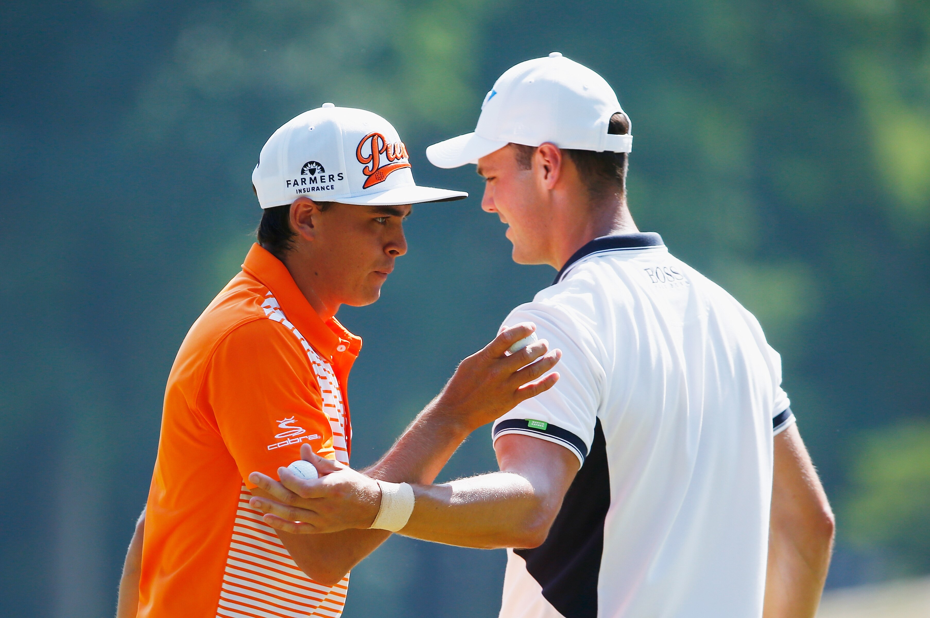 PINEHURST, NC - JUNE 15: (L-R) Rickie Fowler of the United States talks with Martin Kaymer of Germany during the final round of the 114th U.S. Open at Pinehurst Resort & Country Club, Course No. 2 on June 15, 2014 in Pinehurst, North Carolina. (Photo by Sam Greenwood/Getty Images)