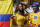 A Colombian supporter smiles as she waits for the start of the group C World Cup soccer match between Colombia and Greece at the Mineirao Stadium in Belo Horizonte, Brazil, Saturday, June 14, 2014.   (AP Photo/Jon Super)