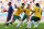 Australia's Mile Jedinak (15) celebrates with his teammates after kicking a penalty shot to score his side's second goal during the group B World Cup soccer match between Australia and the Netherlands at the Estadio Beira-Rio in Porto Alegre, Brazil, Wednesday, June 18, 2014. (AP Photo/Jon Super)
