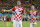 Croatia's Mario Mandzukic, left, celebrates with teammate Ivan Perisic after scoring his side's fourth goal during the group A World Cup soccer match between Cameroon and Croatia at the Arena da Amazonia in Manaus, Brazil, Wednesday, June 18, 2014.  (AP Photo/Marcio Jose Sanchez)