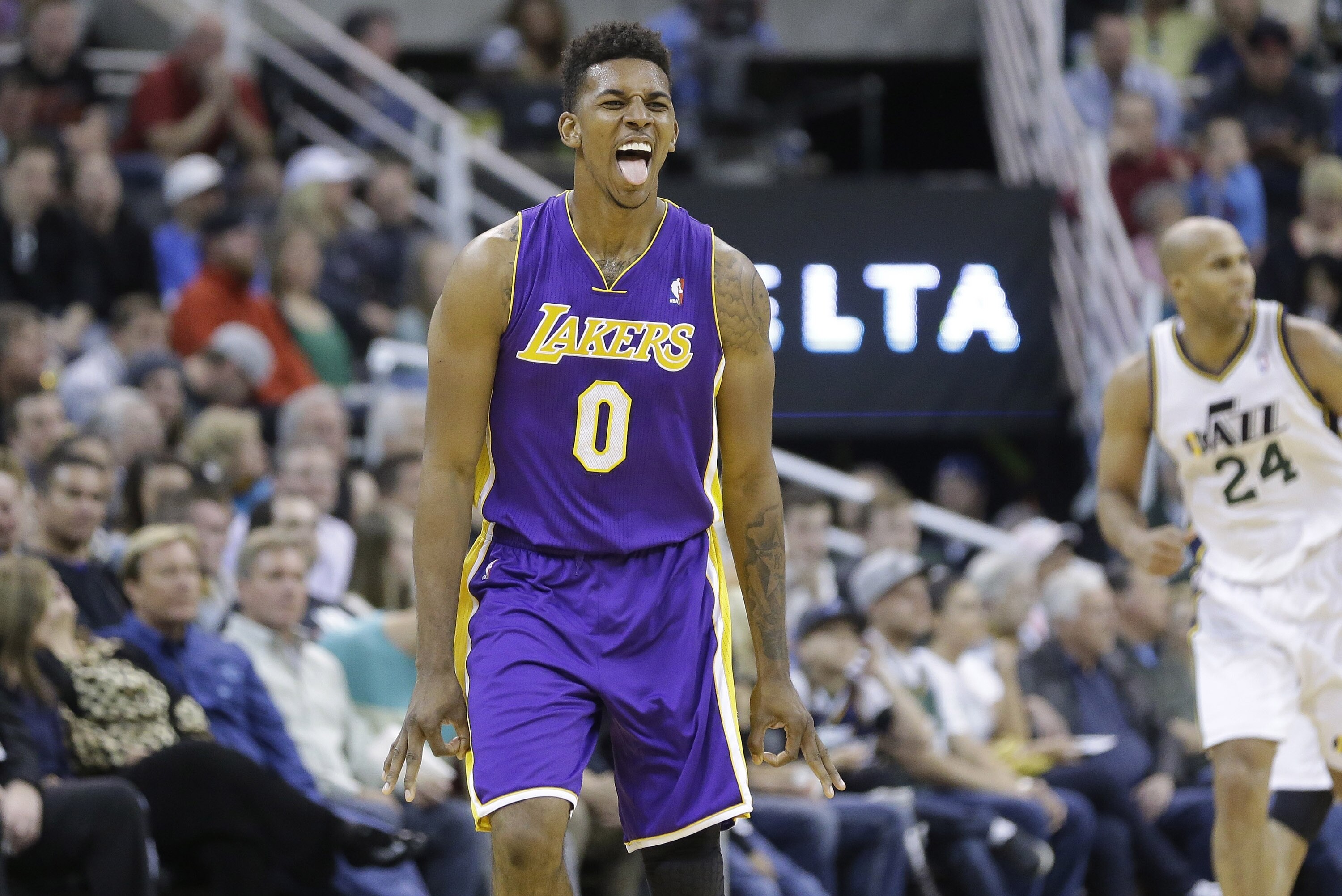 Los Angeles Lakers' Nick Young (0) reacts after hitting a 3-pointer in the second half during an NBA basketball game the Utah Jazz Monday, April 14, 2014, in Salt Lake City, Utah. (AP Photo/Rick Bowmer)