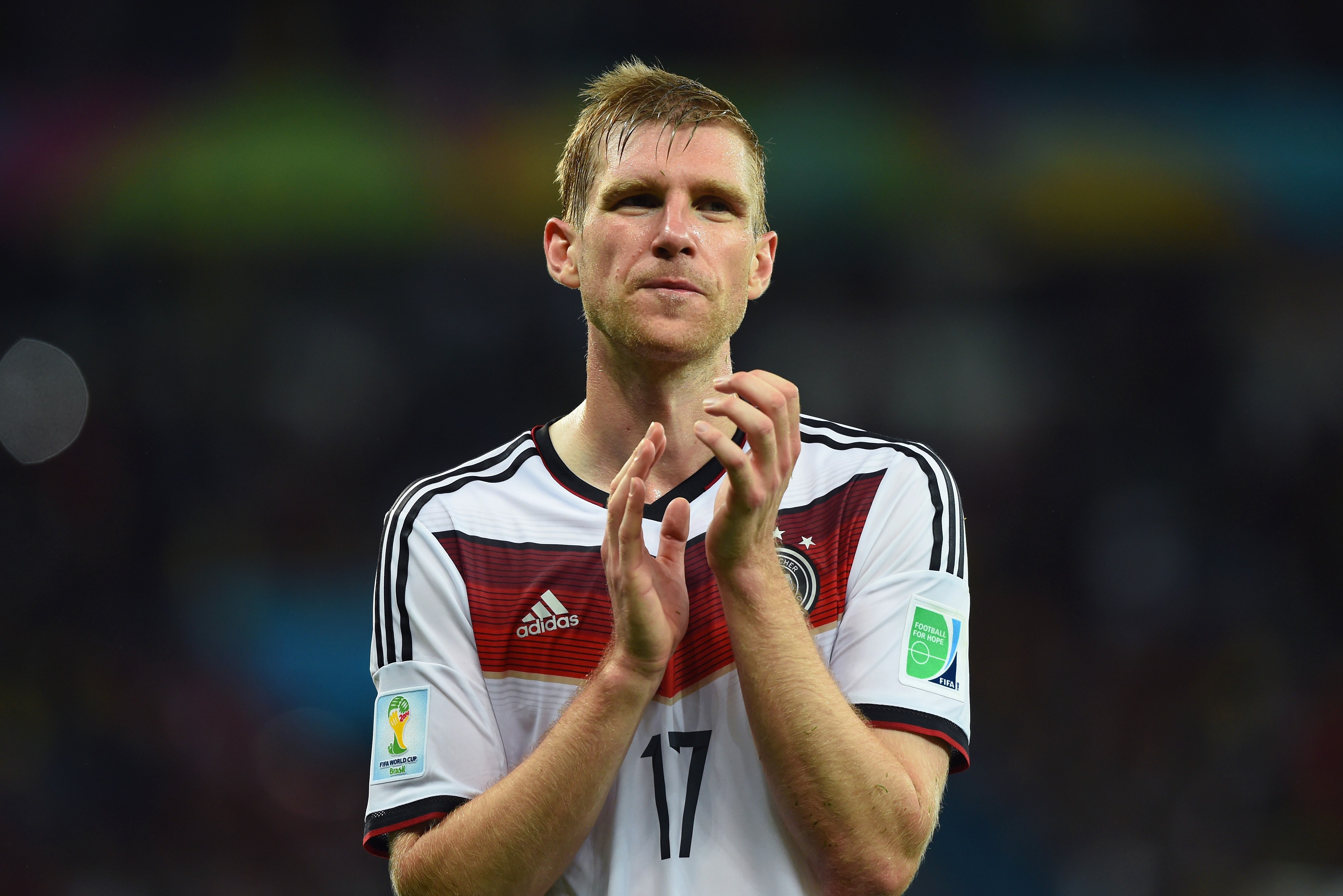 PORTO ALEGRE, BRAZIL - JUNE 30: Per Mertesacker of Germany acknowledges the fans after defeating Algeria 2-1 during the 2014 FIFA World Cup Brazil Round of 16 match between Germany and Algeria at Estadio Beira-Rio on June 30, 2014 in Porto Alegre, Brazil. (Photo by Matthias Hangst/Getty Images)