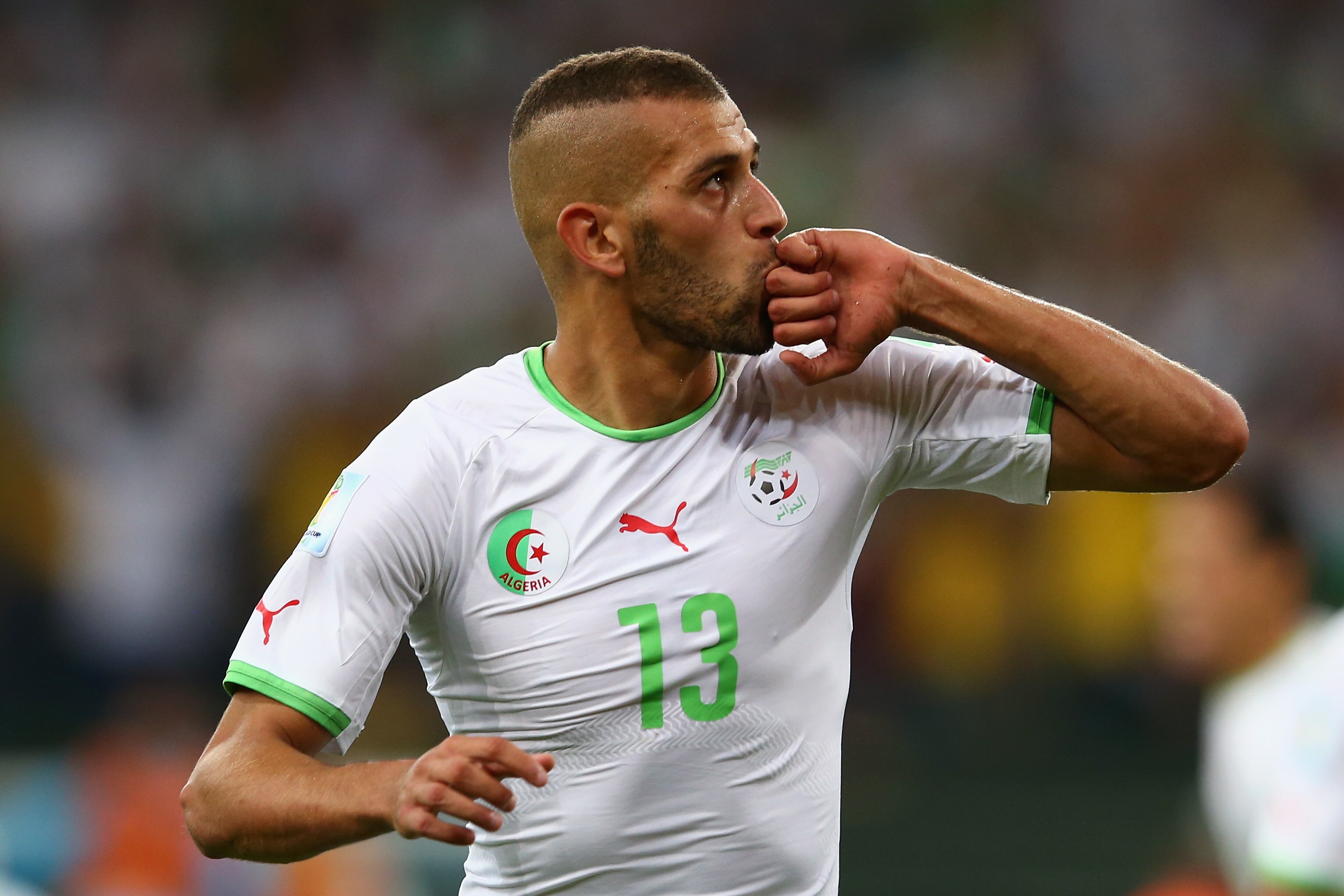 CURITIBA, BRAZIL - JUNE 26: Islam Slimani of Algeria celebrates scoring his team's first goal during the 2014 FIFA World Cup Brazil Group H match between Algeria and Russia at Arena da Baixada on June 26, 2014 in Curitiba, Brazil. (Photo by Julian Finney/Getty Images)